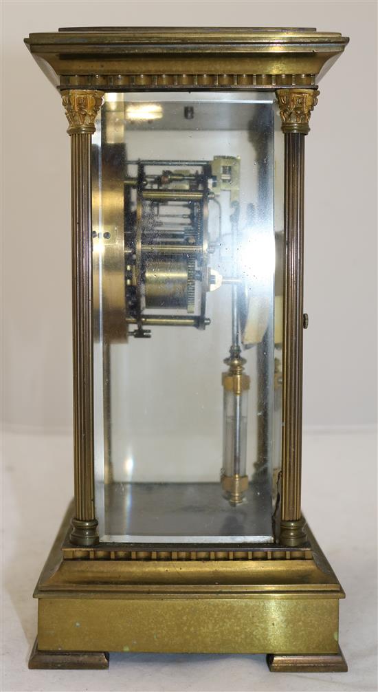 An Edwardian brass four glass mantel clock, 11in.